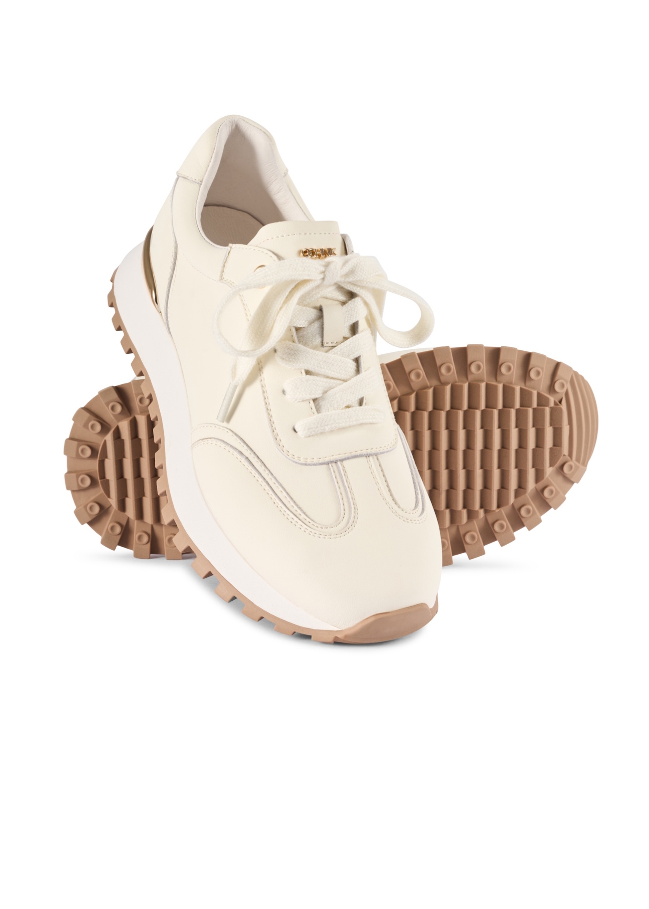 Skórzane sneakersy damskie w kolorze kremowym BUTYD-1270-0B(W26), widok produktu skosem na białym tle.