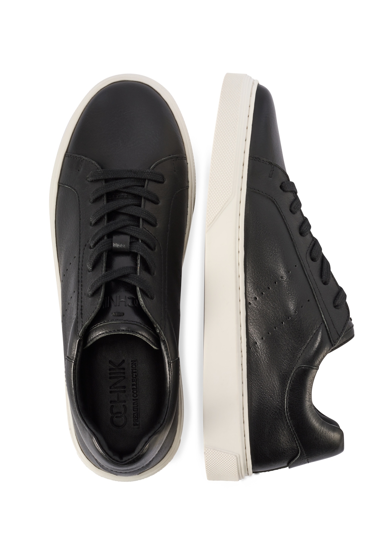 Czarne skórzane sneakersy męskie BUTYM-0486-99(W26), widok produktu z góry na białym tle.